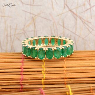 Elegant emerald eternity wedding band crafted in 14K white gold