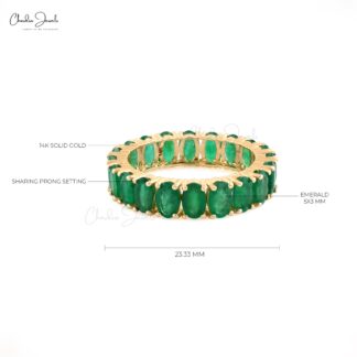 Fine jewelry emerald eternity band ring with vibrant green emeralds